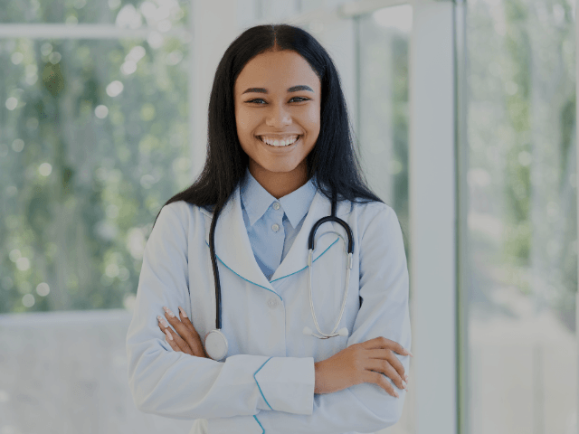 doctor smiling with a stethoscope